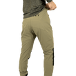 Load image into Gallery viewer, Model wearing Odyssey Activewear Shield Trousers in Khaki adjusting the elasticated waist band
