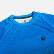 Load image into Gallery viewer, Detail shot of the Odyssey Activewear Triangulation Cobalt T-shirt showing the breathable, quick-drying fabric and blue triangle pattern