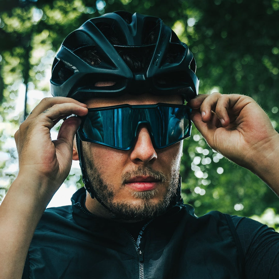 Road cyclist wearing Odyssey Activewear Cyclops riding glasses