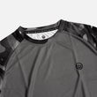 Load image into Gallery viewer, Detail shot of the Odyssey Activewear Dark Camo T-shirt showing the breathable, quick-drying fabric and black and grey camouflage colour scheme