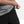 Load image into Gallery viewer, Detail shot showing adjustment of the elastic waist band on the Odyssey Activewear Shield Shorts
