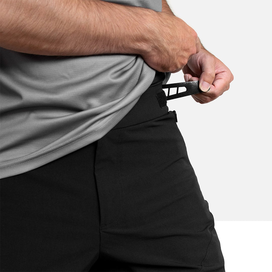 Detail shot showing adjustment of the elastic waist band on the Odyssey Activewear Shield Shorts