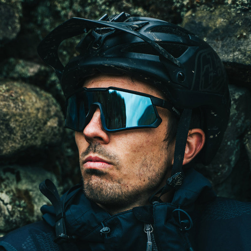 Odyssey Activewear Cyclops Sports Sunglasses with Ice Blue lens worn by a mountain biker