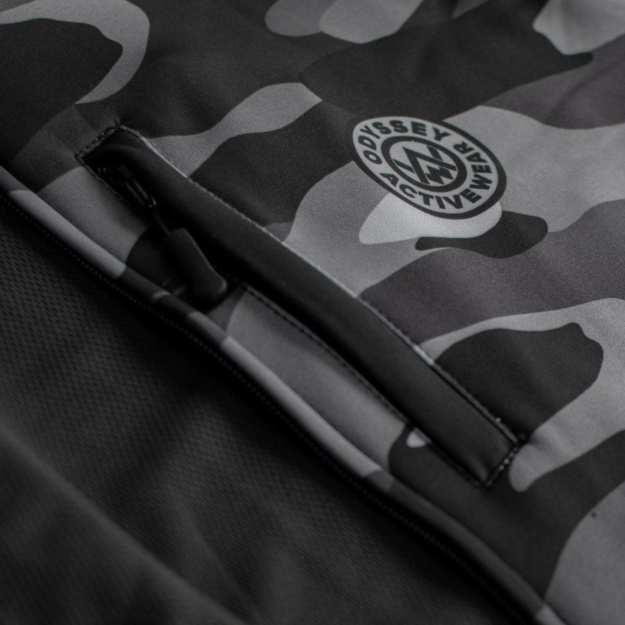Detail shot of the chest accessory pocket on the Odyssey Activewear Dark Camo Tech Hoodie