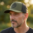 Load image into Gallery viewer, Odyssey Activewear® “Origins” Trucker Cap
