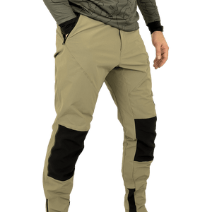 Model wearing Odyssey Activewear Shield Trousers in Khaki with hand in pocket