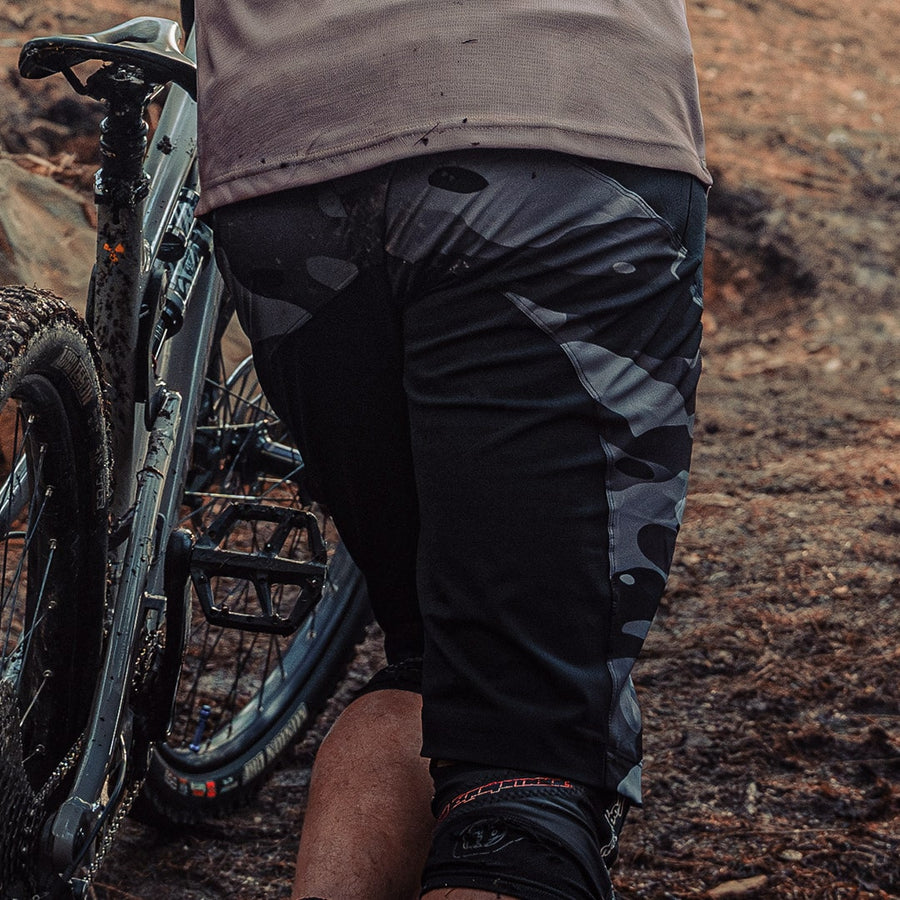 Odyssey Activewear Dark Camo Shield Shorts worn while mountain biking
