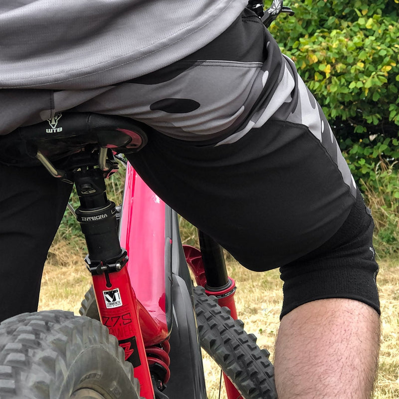 Mountain biker wearing Odyssey Activewear Camo MTB Shorts