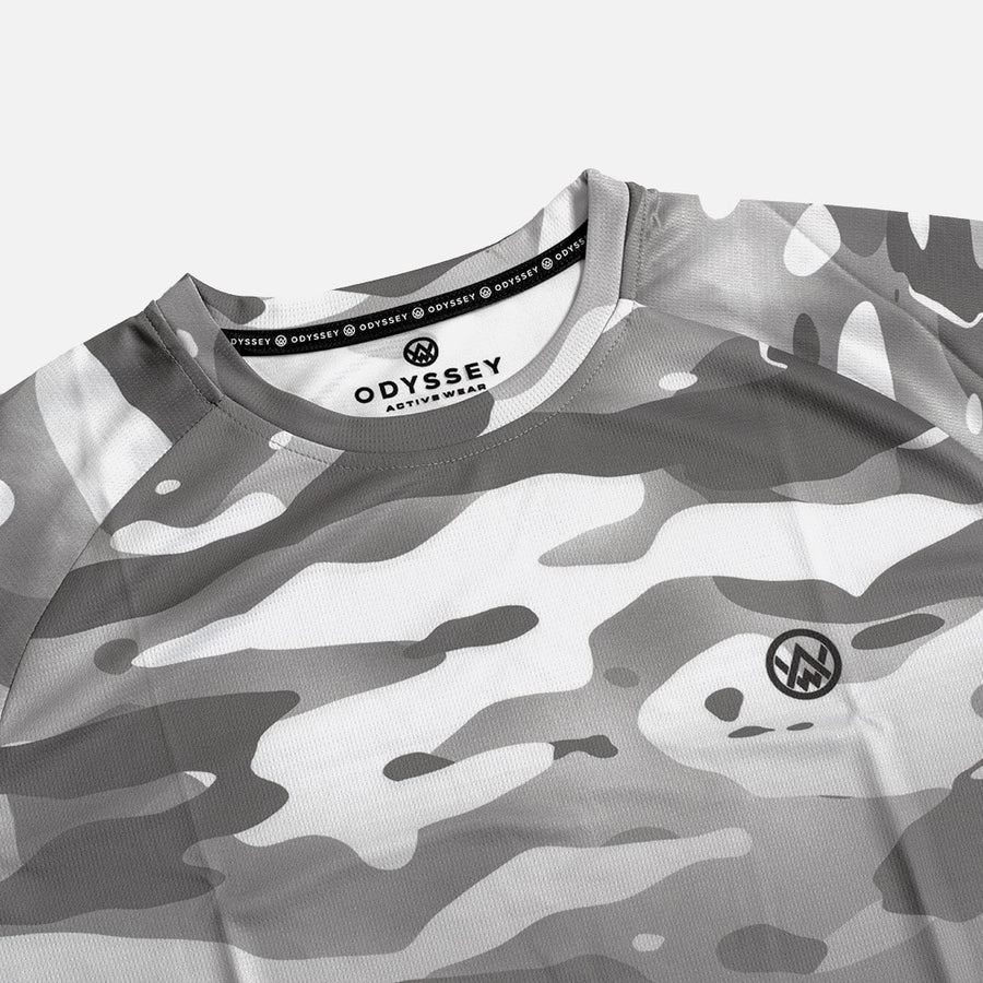 Detail shot of the Odyssey Activewear Arctic Camo jersey showing the breathable, quick-drying fabric and grey & white camouflage colour scheme