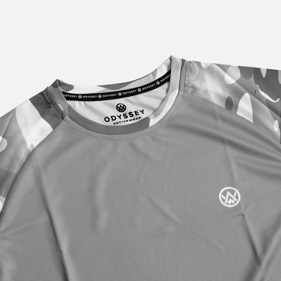 Detail shot of the Odyssey Activewear Arctic Camo jersey showing the breathable, quick-drying fabric and grey and white camouflage colour scheme