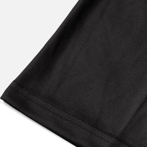 Detail shot of the Odyssey Activewear Dark Camo jersey showing the breathable and quick-drying fabric