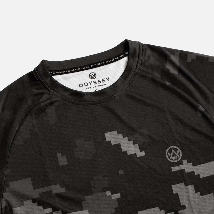 Detail shot of the Odyssey Activewear Stealth Digital Camo T-Shirt with a black and grey pixel colour scheme
