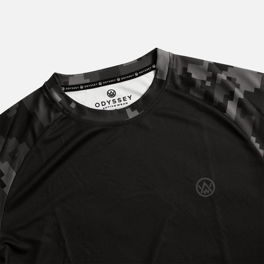 Detail shot of the Odyssey Activewear Stealth Digital Camo jersey with a black and grey pixel colour scheme