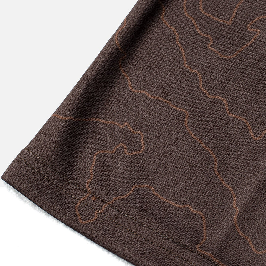 Detail shot of the Odyssey Activewear Contour Earth jersey showing the breathable and quick-drying fabric
