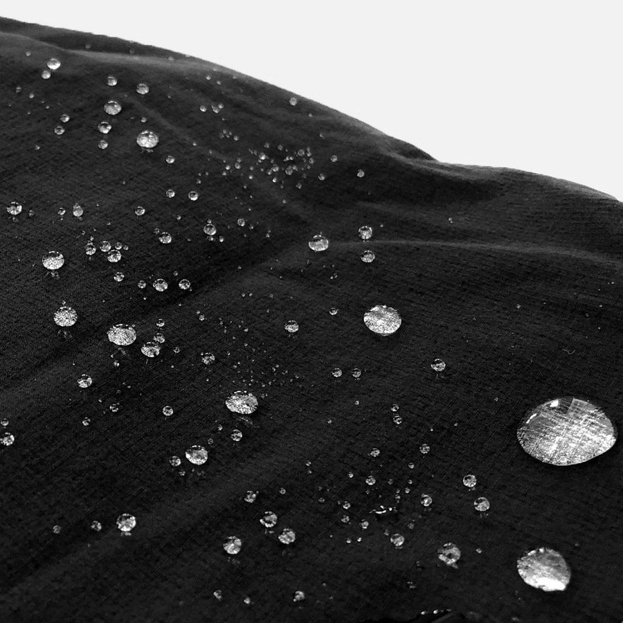 Close up shot of water drops on fabric showing the water repellent feature of the Odyssey Activewear Shield Shorts