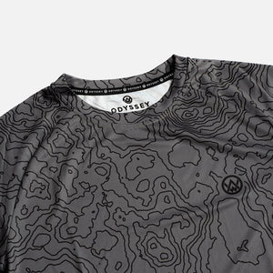 Detail shot of the Odyssey Activewear Contour Slate T-shirt showing the breathable, quick-drying fabric and grey topographic map pattern
