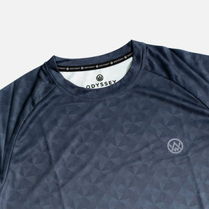 Detail shot of the Odyssey Activewear Triangulation Steel jersey showing the breathable, quick-drying fabric and blue and grey triangle pattern